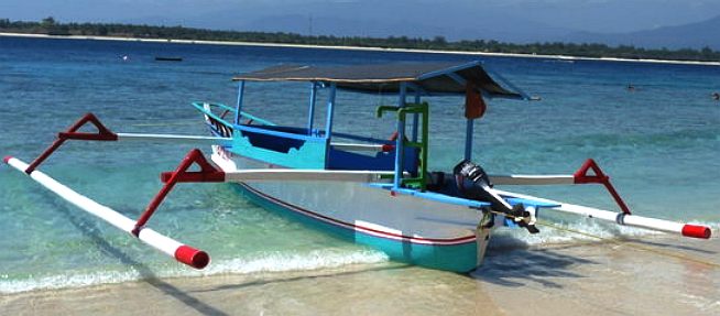 Bali, Indonesia, bamboo outriggers to stabilise a tourist boat