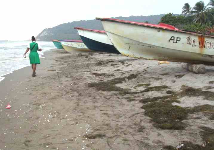 Jamaican sandy beach and fishing boats