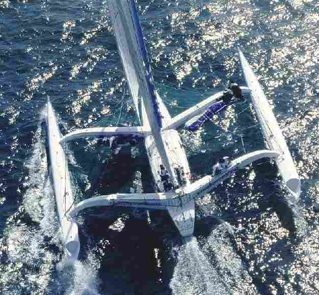 Aerial view of a beautiful trimaran blue water sailing